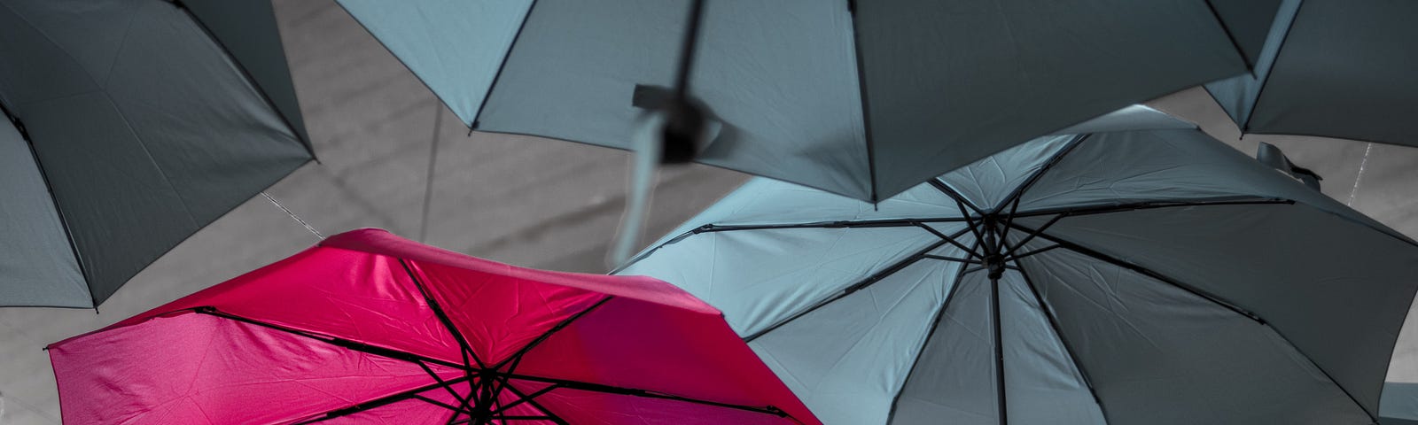 Red umbrella representing different and unique and how each person is special