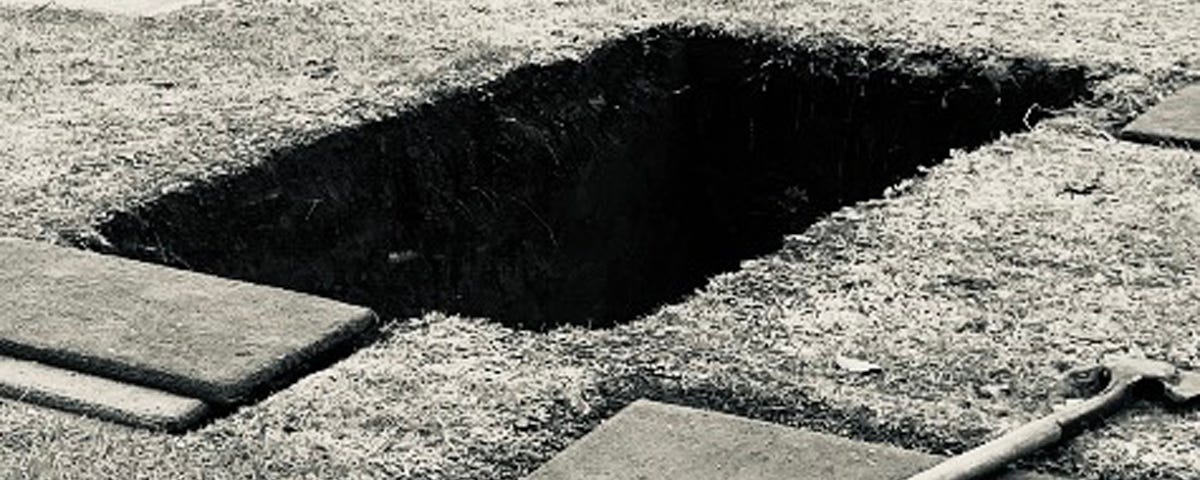 Photo of an open grave by Mark Tulin.