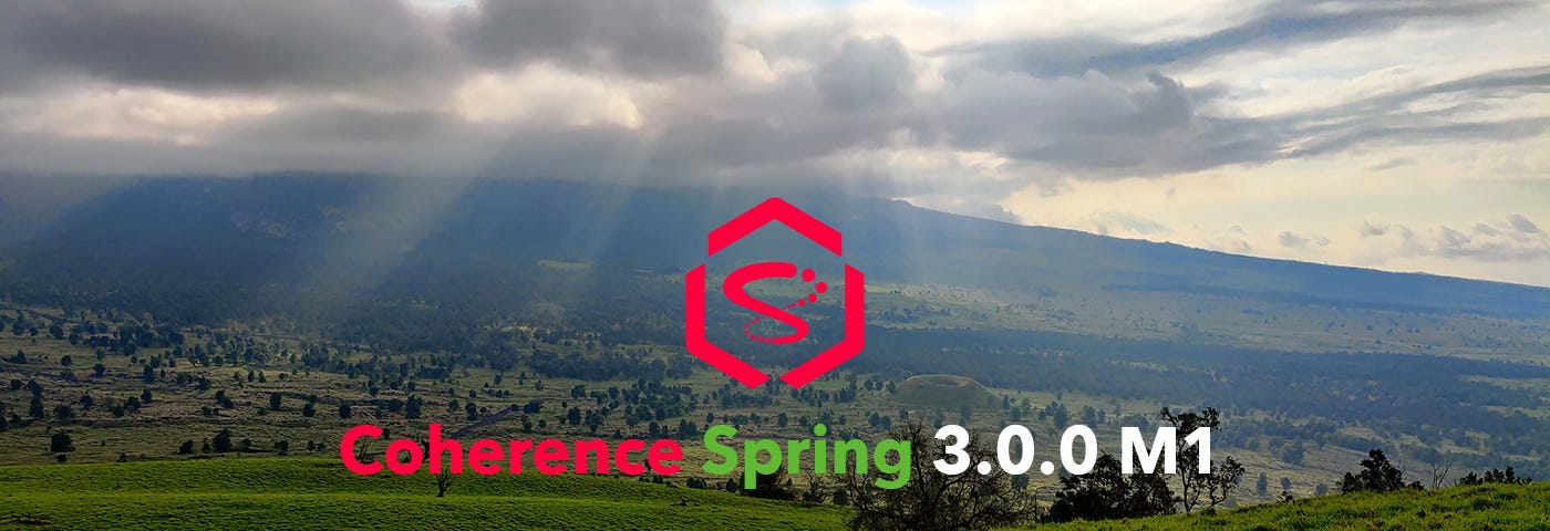 Photo of the Hualalai volcano with the sun breaking through clouds on the island of Hawaii with the words “Coherence Spring 3.0.0 M1”.