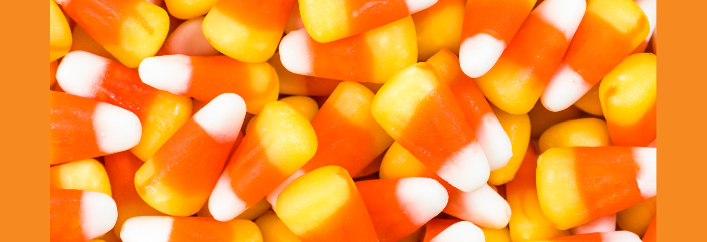 Close-up of white, orange, and yellow candy corn pieces.