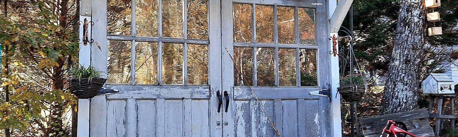 Photo of old reused garage doors hung in the garden