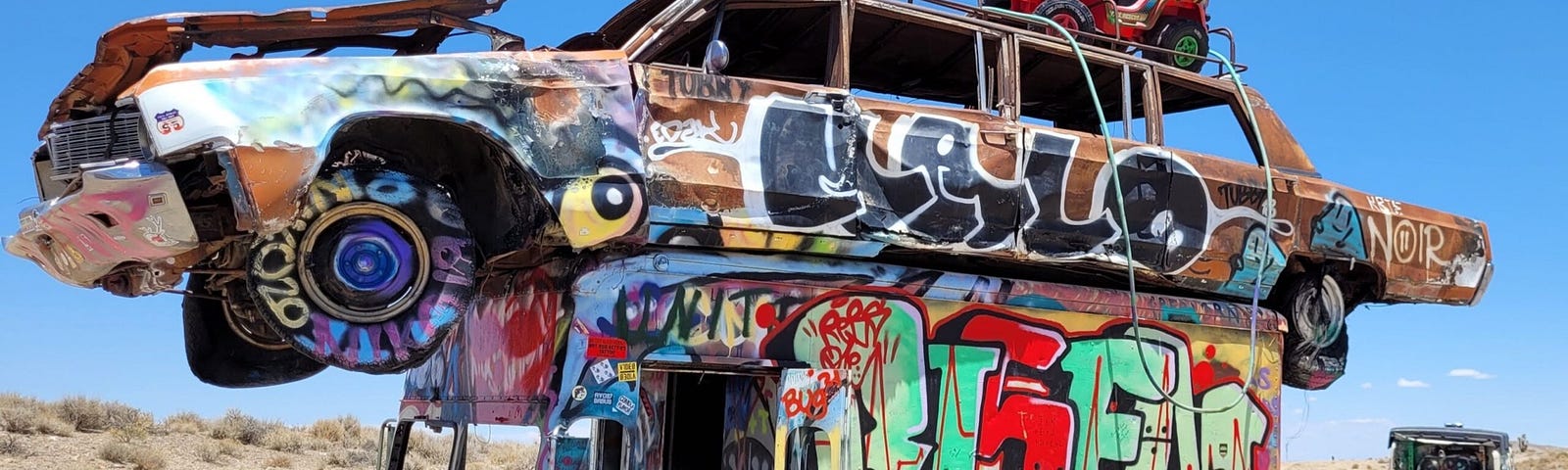 Junked vehicles covered in graffitis.