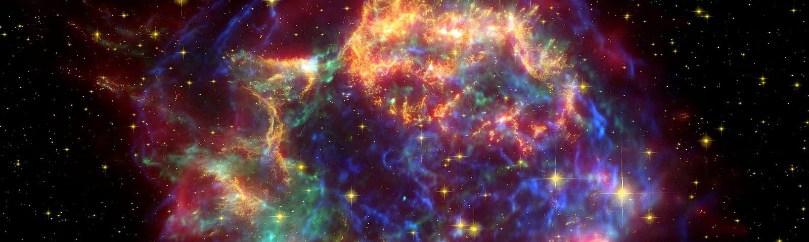 a multicolored explosion in space, cassiopeia