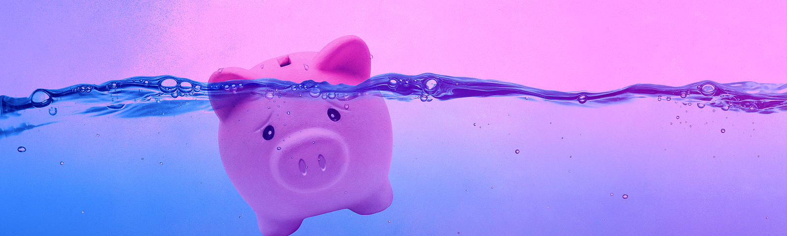 A piggy bank wearing a sad expression is in high water, at risk of drowning.