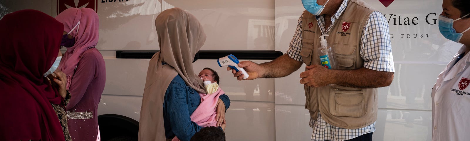 In the area of Khaldieh towards Tripoli, the poorest city in Lebanon, Lebanese and Syrian refugee families are waiting to be received at the medical bus of the Order of Malta NGO, August 2021. Photo by Didier Bizet/Hans Lucas via Reuters