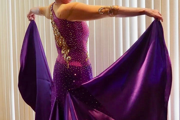 Photo of the author in a purple ballroom gown