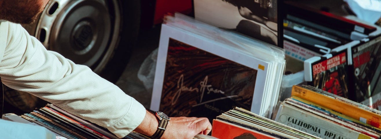 A man flips through old records