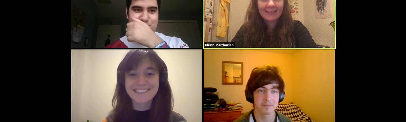 A screenshot from Zoom with four people smiling