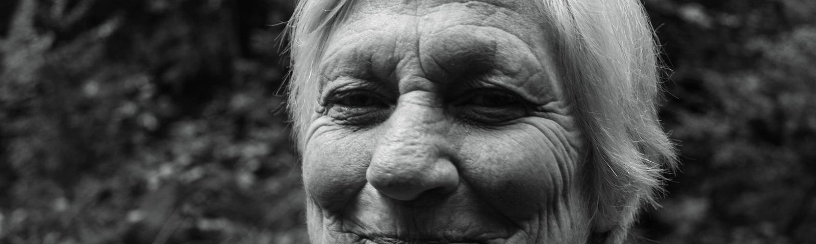 An old woman smiling.