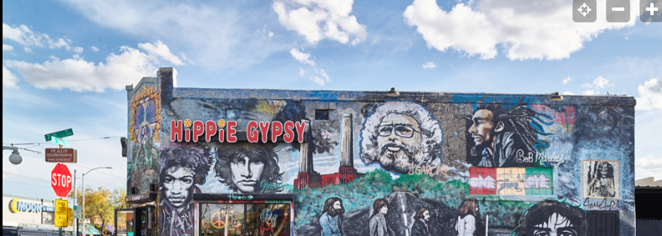 hand drawn and painted hippie mural on the side of a building — Bob Marley, Beatles Hippie Gypsy, peace signs (My formative years)