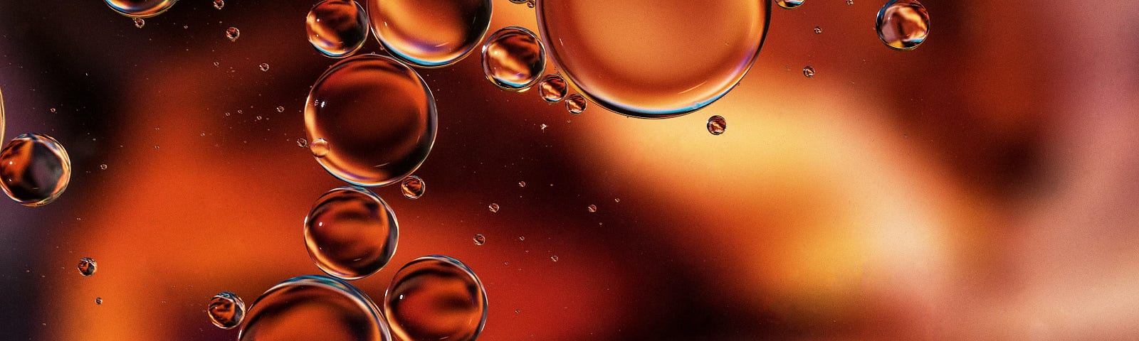 Bubbles float against a copper background. Copper, an essential trace element in the body, is essential for numerous physiological processes. While copper is necessary for normal cellular functions, its dysregulation or accumulation can potentially contribute to the development and progression of certain types of cancer.