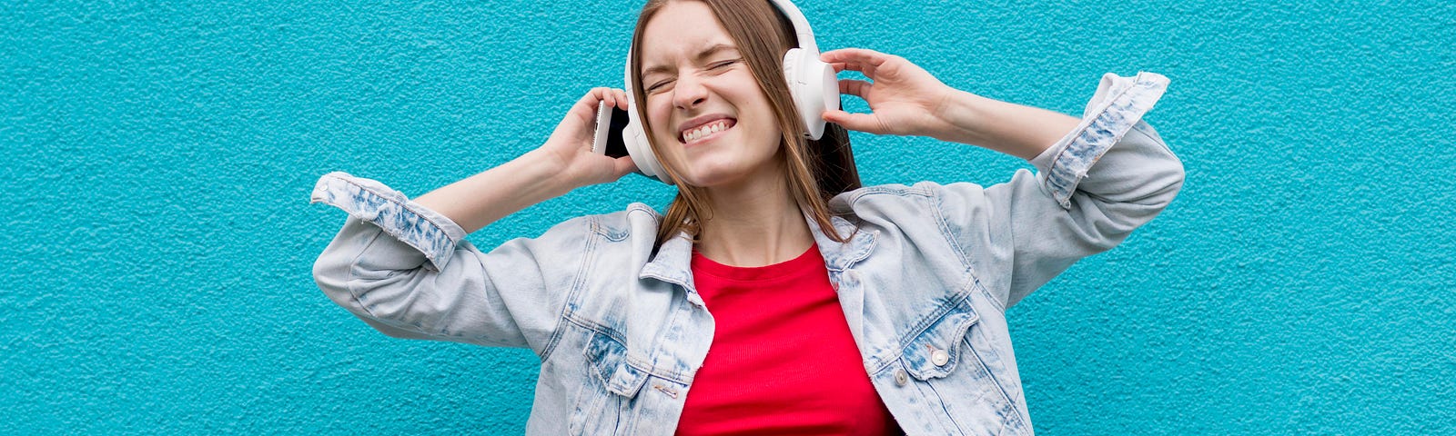 happy woman listening to music in headphones
