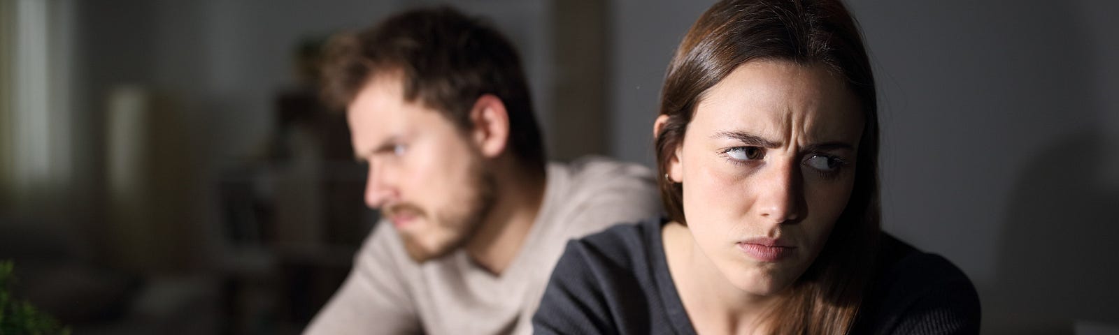 Angry couple ignoring each other and not communicating