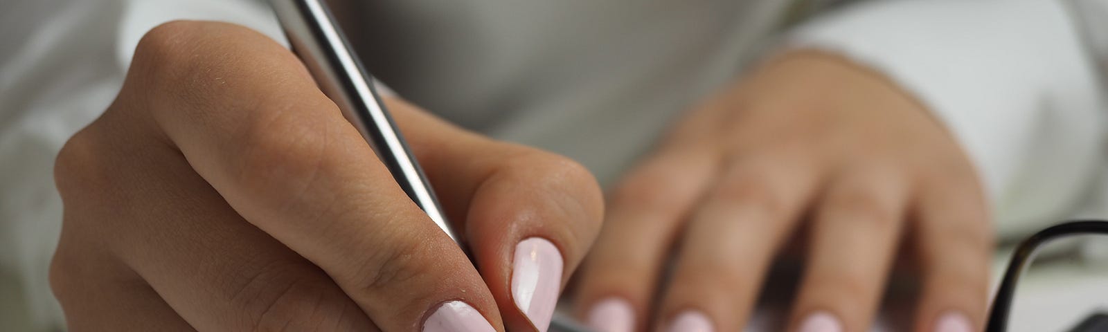 Woman writing by hand