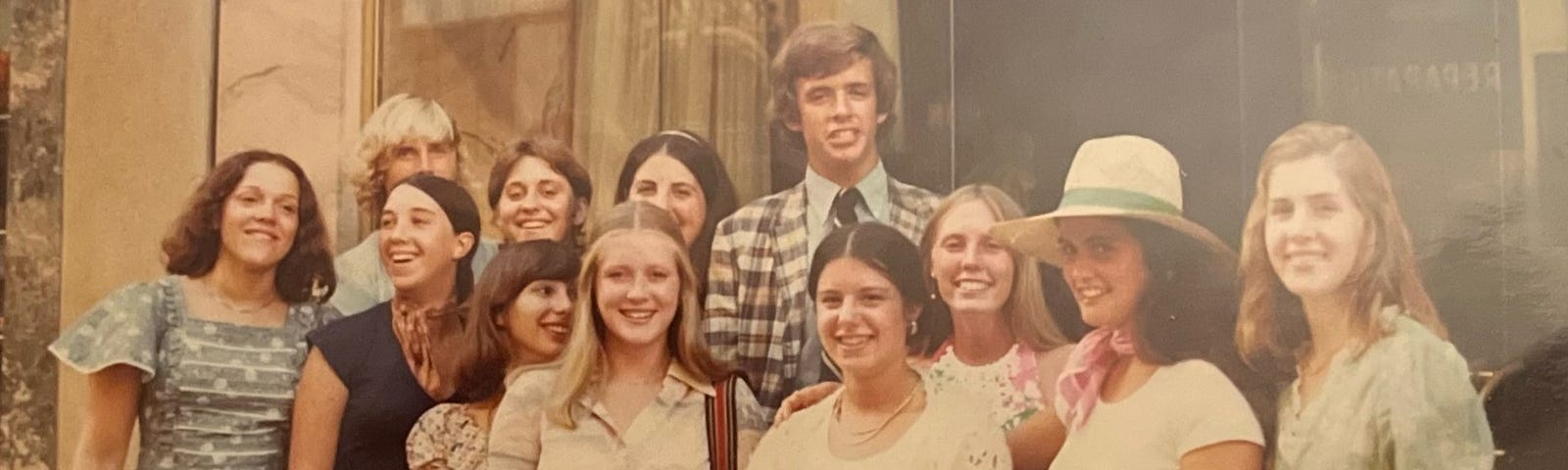 Three young men and eight young ladies in Paris with an adult guide.