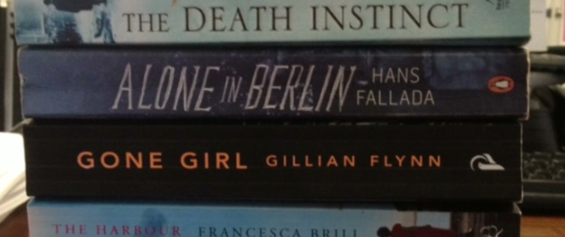 A pile of novels with the spines showing