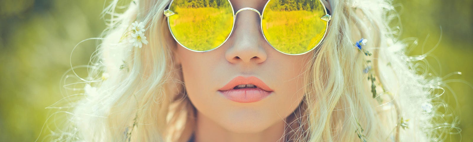 Girl in sunshine with bright yellow round sunglasses