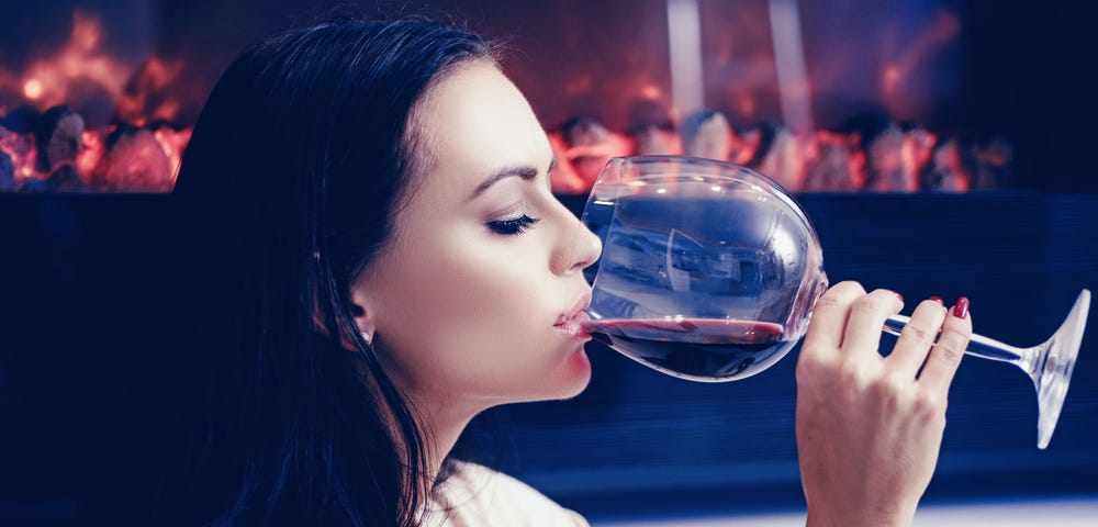 French woman drinking a glass of red wine