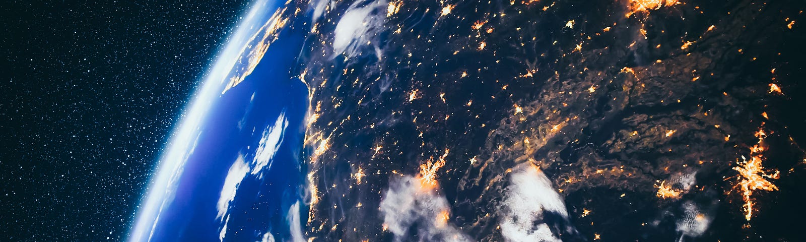 The Earth from space, showing a night view of the United States, looking east over the Caribbean. Photo by Blue Planet Studio/Adobe Stock