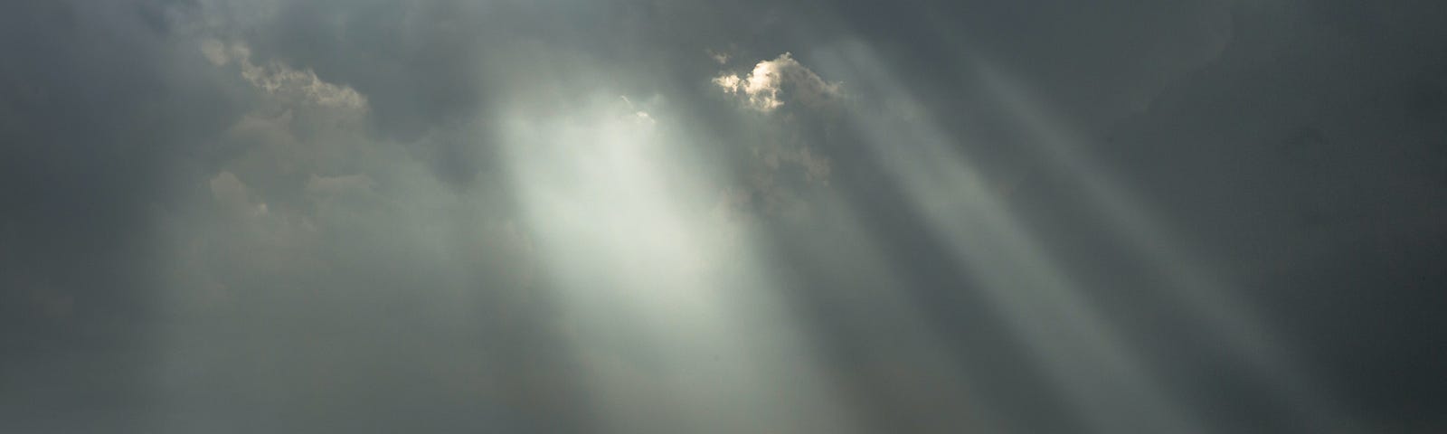 Sun’s rays fall on a beach.