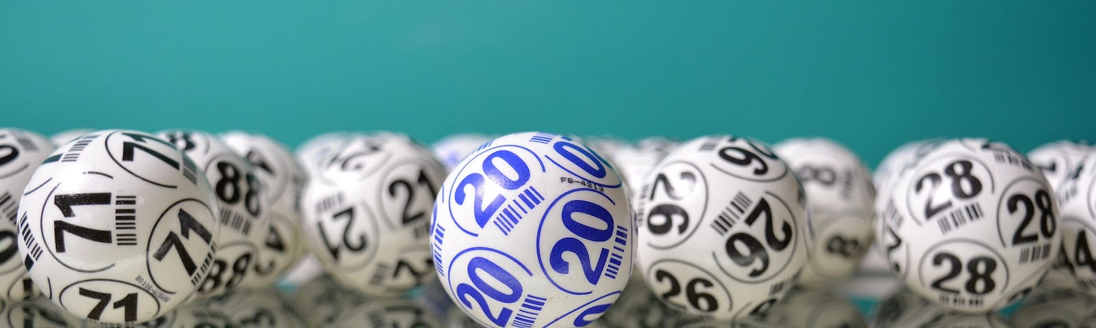 Lottery balls on a teal background