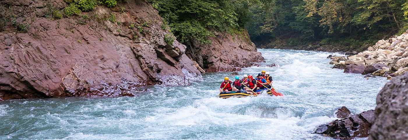 Group whitewater rafting on dangerous waters.