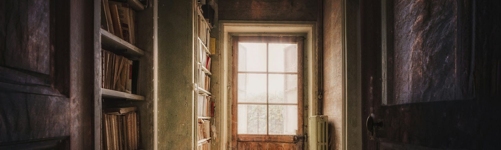 Photo of an old room with a book shelf.