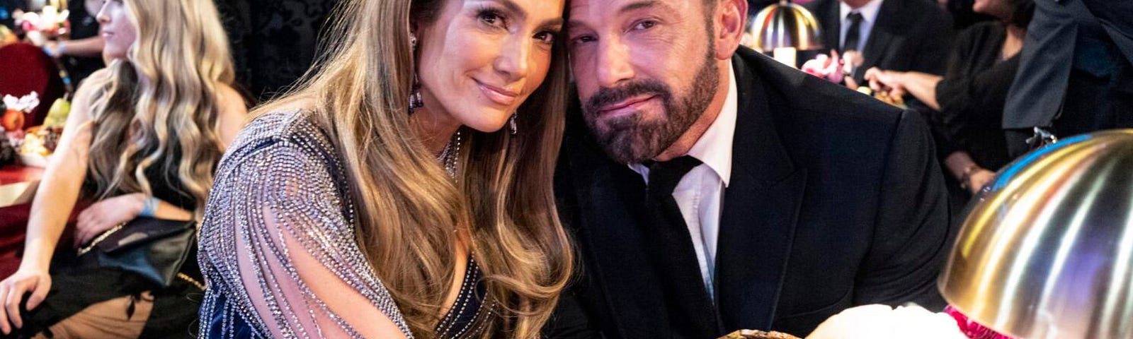 Jennifer Lopez and Ben Affleck posing for a picture.