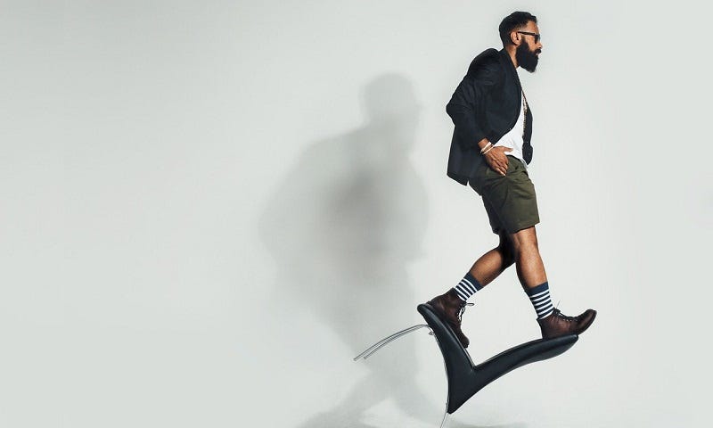 Man balancing on a chair