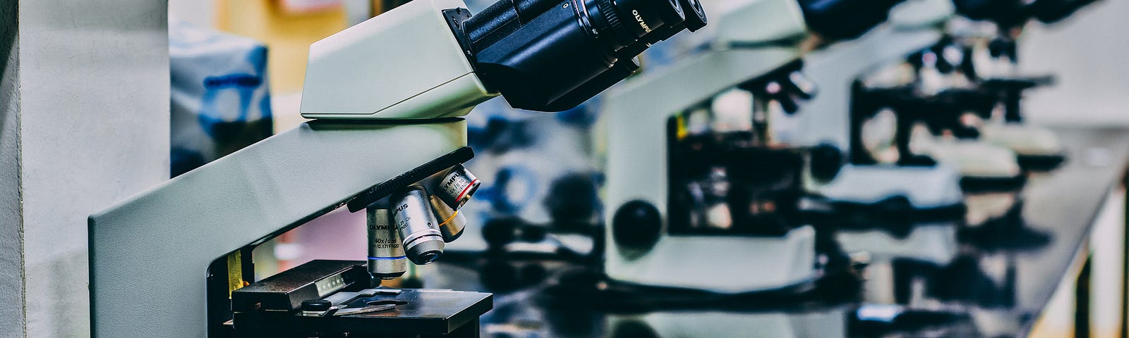 White microscopes on black table