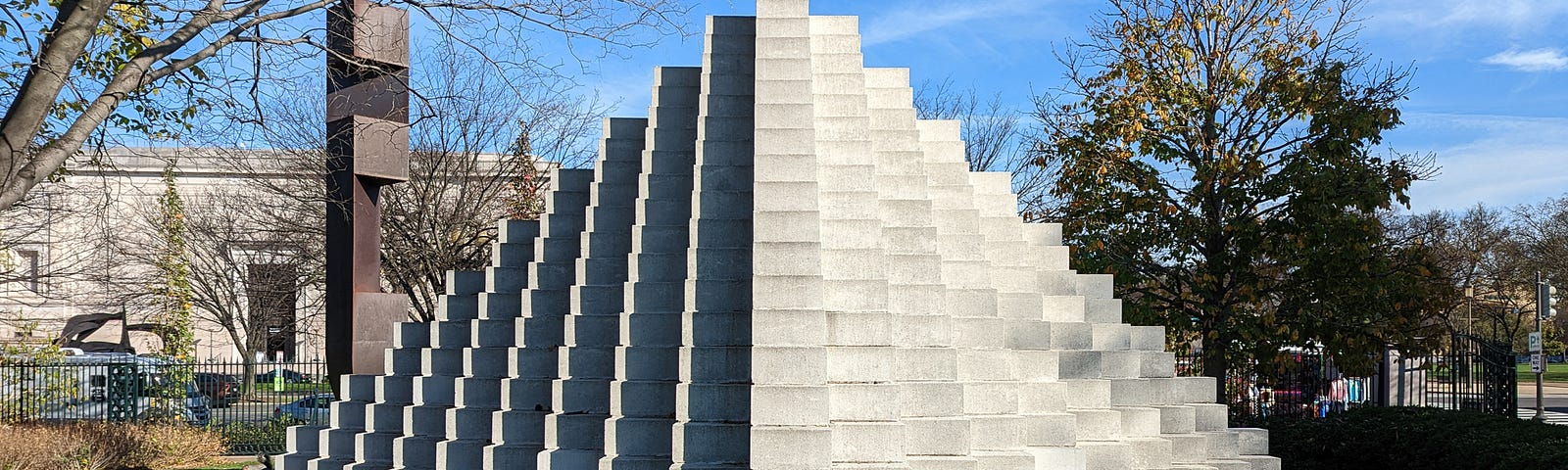 Pyramid shaped sculpture made up of hundreds of cement blocks