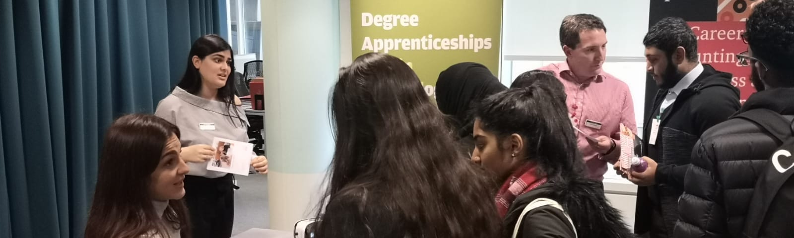 Students networking at careers stalls