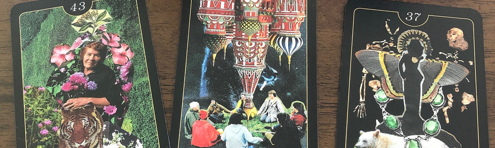 From left to right, three oracle cards — Strength, Circle, and Death are on a dark brown wooden table. Each card shows a collage representing each word. The Strength card shows an elder holding flowers with a tiger. The Circle card in the middle shows people in a circle holding hands with upside-down structures pointing to the people. The Death card shows a dark silhouette with wings standing on top of a white bear that is lying on a large bed of green grass.