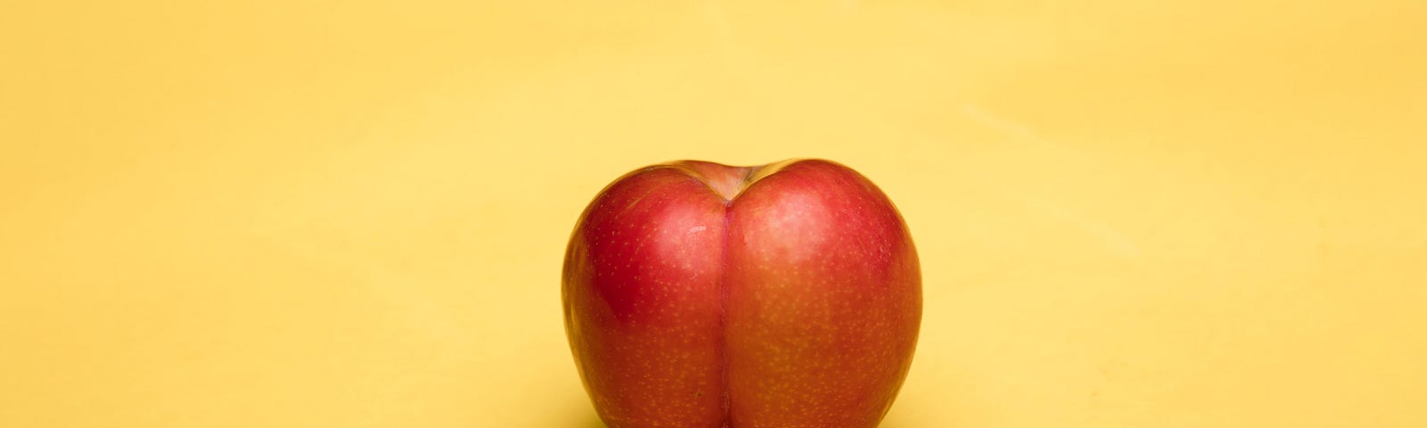 Metaphorically loaded image of a peach that looks like a human butt