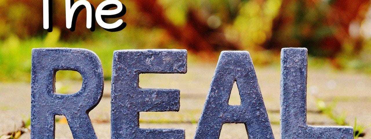 Letters on a pavewalk forming the phrase ‘The REAL Life’.