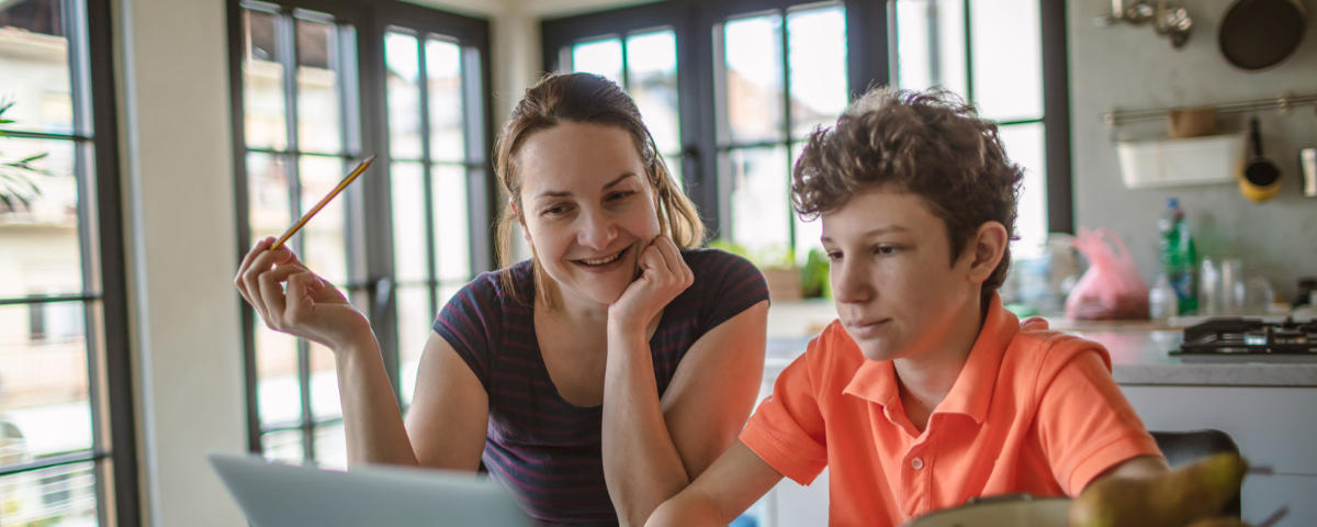 Mother and son doing home schooling.