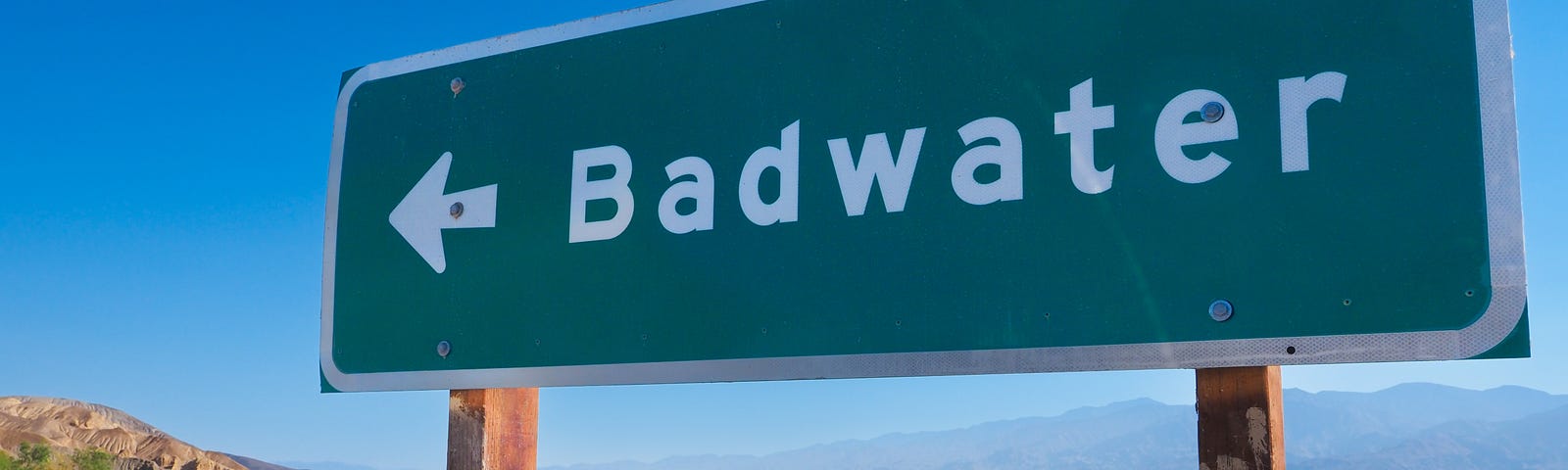 Photo of the Badwater Basin turnoff sign near Furnace Creek, CA, in Death Valley National Park. The dry lake bed is eight miles long by five miles wide and at 282 feet below sea level, is the lowest point in North America. (Photo: ©Craig K. Collins)