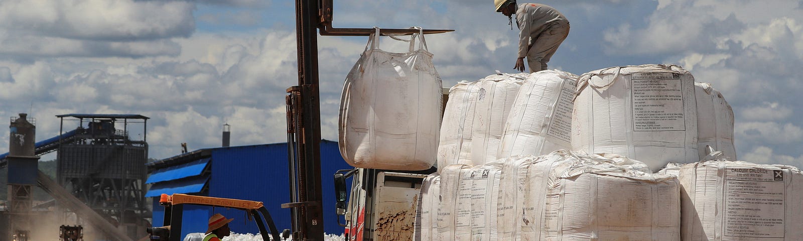 Workers load lithium concentrate at Prospect Lithium Zimbabwe mine in Goromonzi, Zimbabwe, January 9, 2024. Photo by Philimon Bulawayo/Reuters