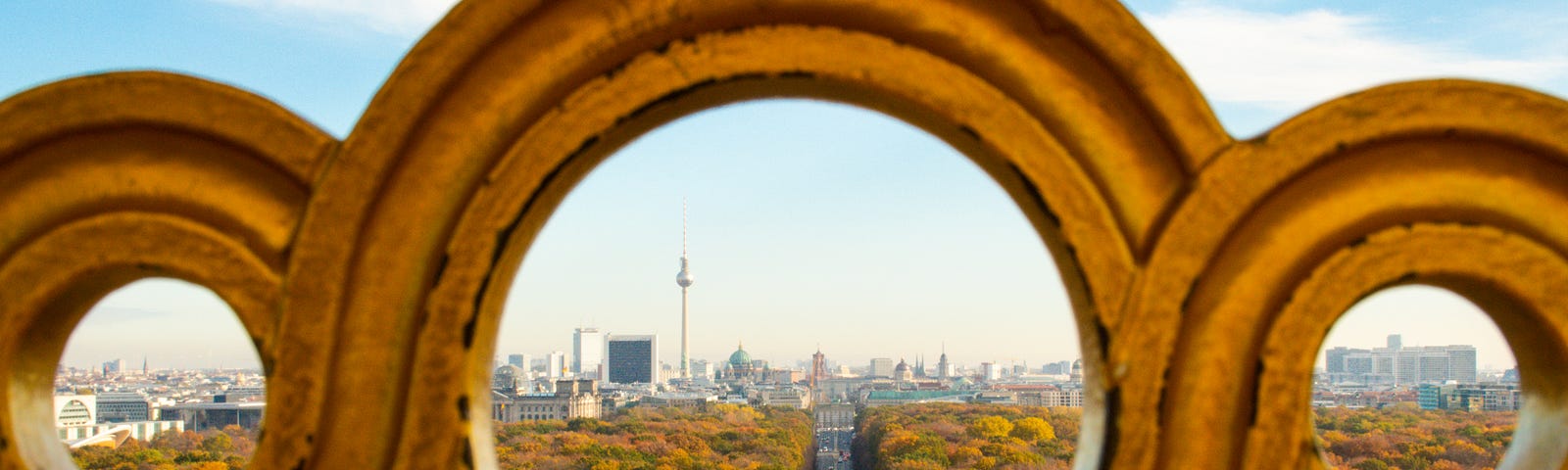 road leading to the city of Berlin Germany seen through a concrete filigreed railing.