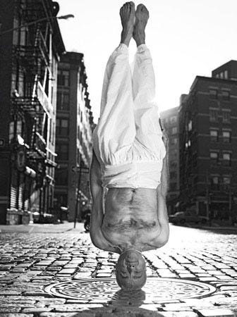 A handsfree headstand taken in NYC by a yoga master. On Yoga: The Architecture of Peace