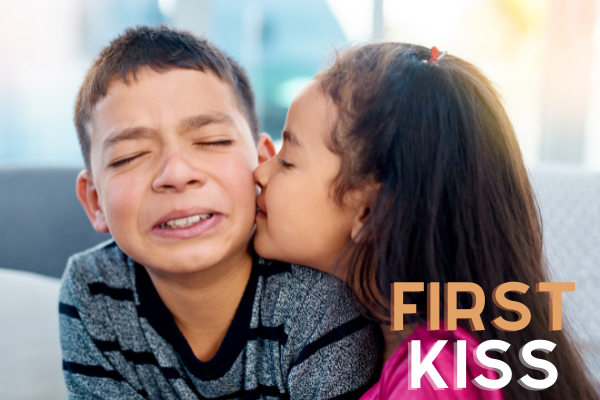 First kiss, young boy and girl.