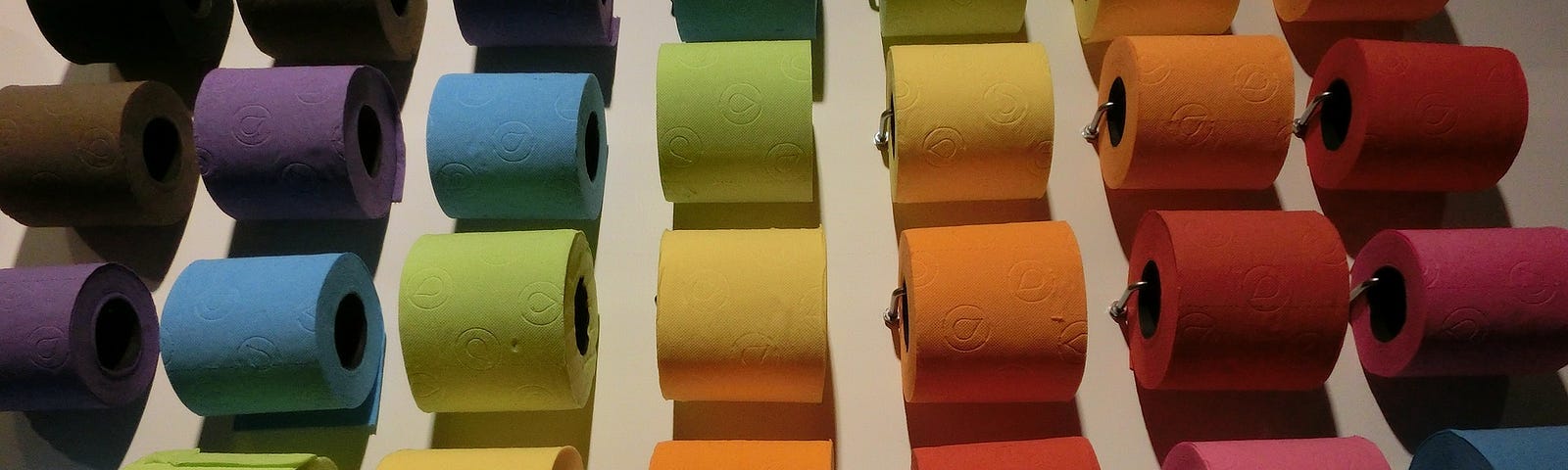 Seven rows of toilet paper in many colors