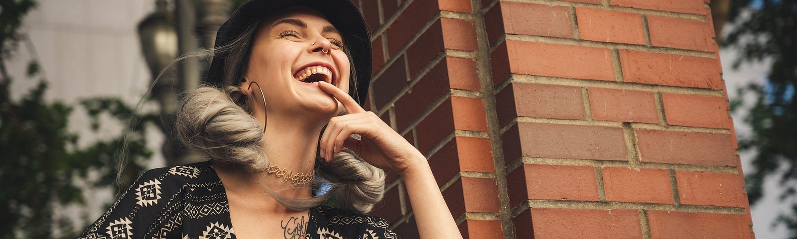 Low angle photo shot of woman smiling wearing crop top