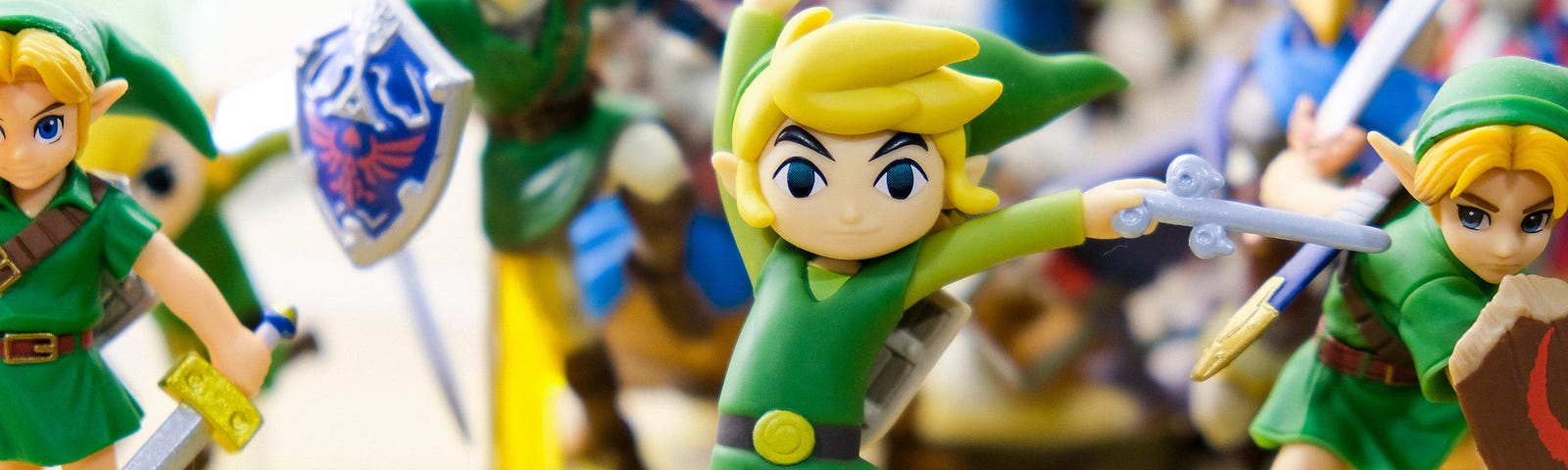 Mini figures of Link from Zelda waving their swords or standing ready to battle.