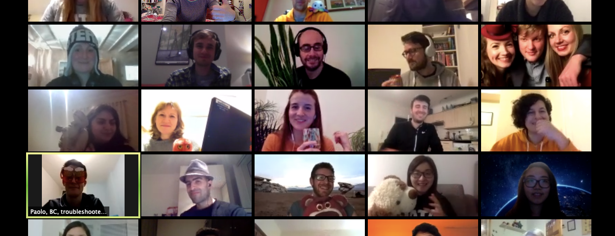 Screenshot of a zoom meeting with roughly 25 people, smiling, some making silly faces