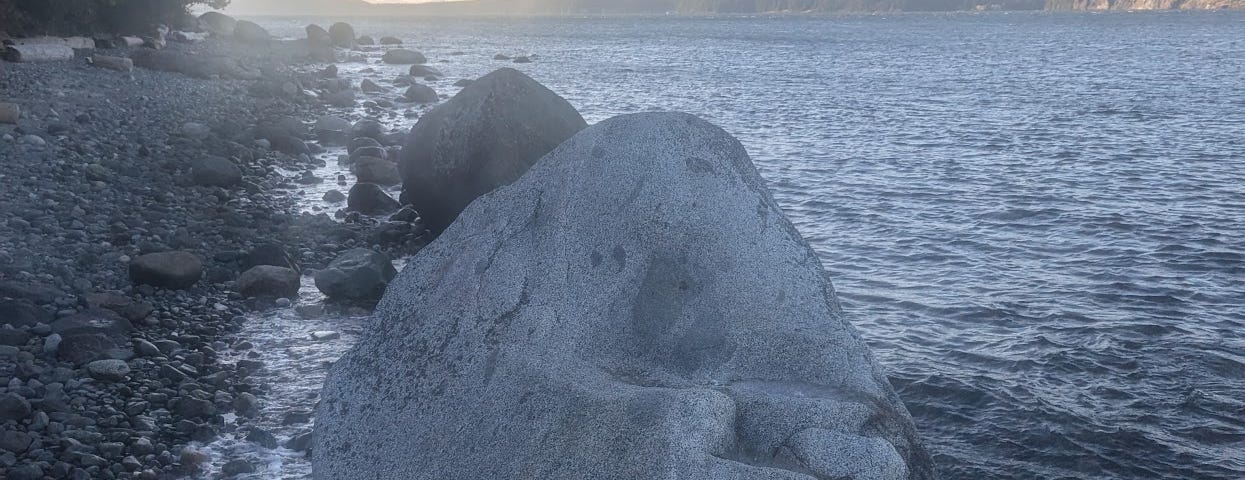 A big rock on a beach