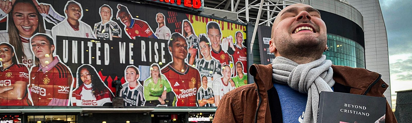 Karlo Tasler outside Old Trafford holding his book ‘Beyond Cristiano’