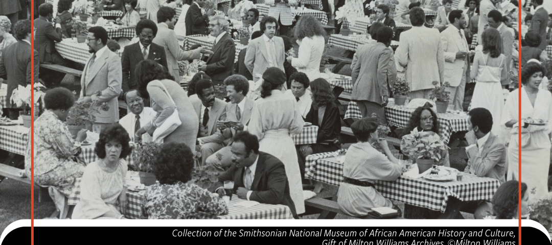 Black and white image of a diverse group of people socializing at picnic tables. Below is a colorful “Juneteenth: Senses of Freedom” logo and the  credit: “Collection of the Smithsonian National Museum of African American History and Culture, Gift of Milton Williams Archives, @Milton Williams”.