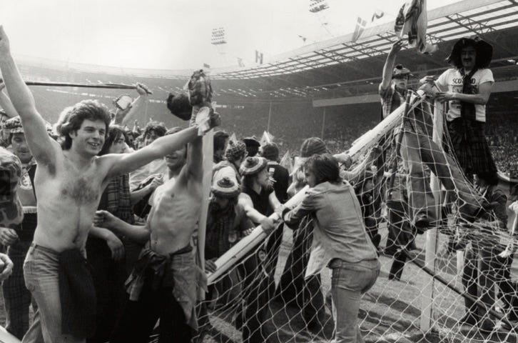Photo of Scotland fans who have invaded the Wembley pitch after a victory over England in 1977