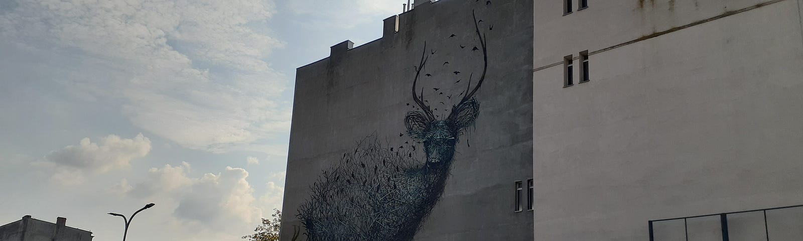 The Murals in Łódź, Poland (a big deer on the wall)